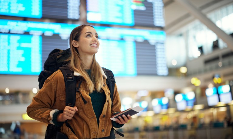 woman at airport with ticket